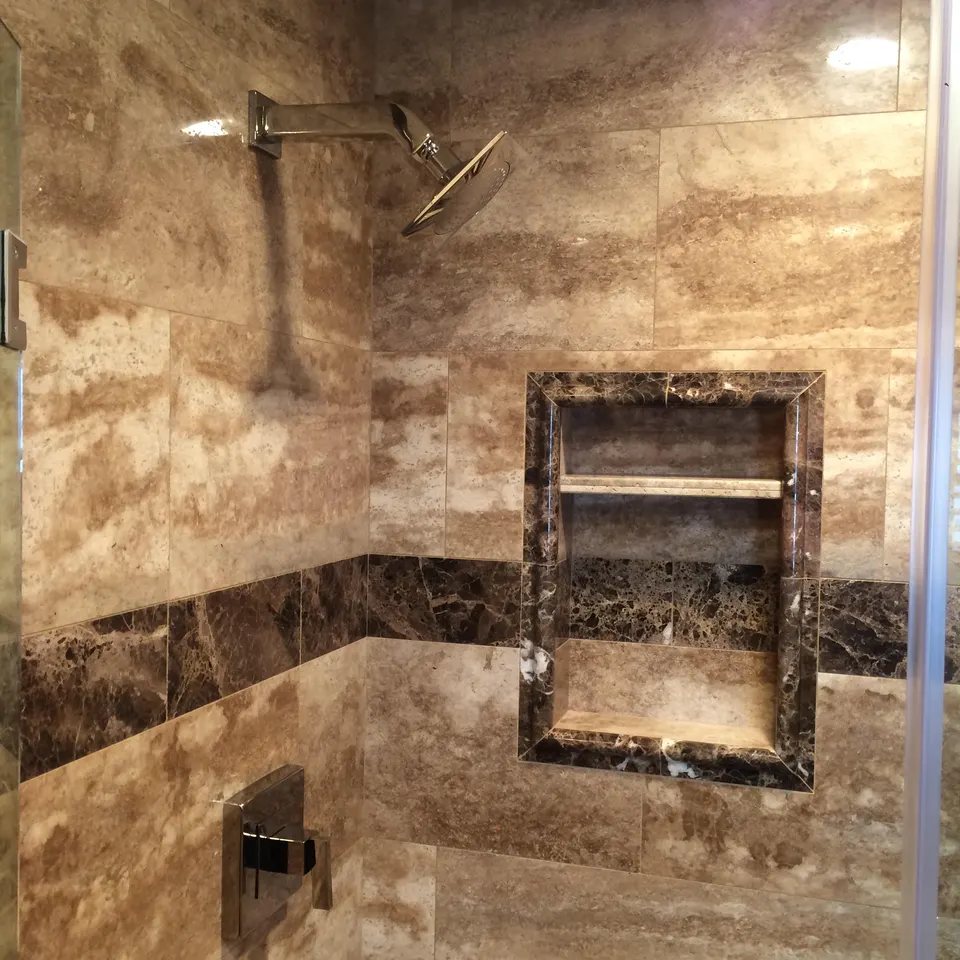 Walk-in tile shower with modern fixtures in a remodeled Chino bathroom